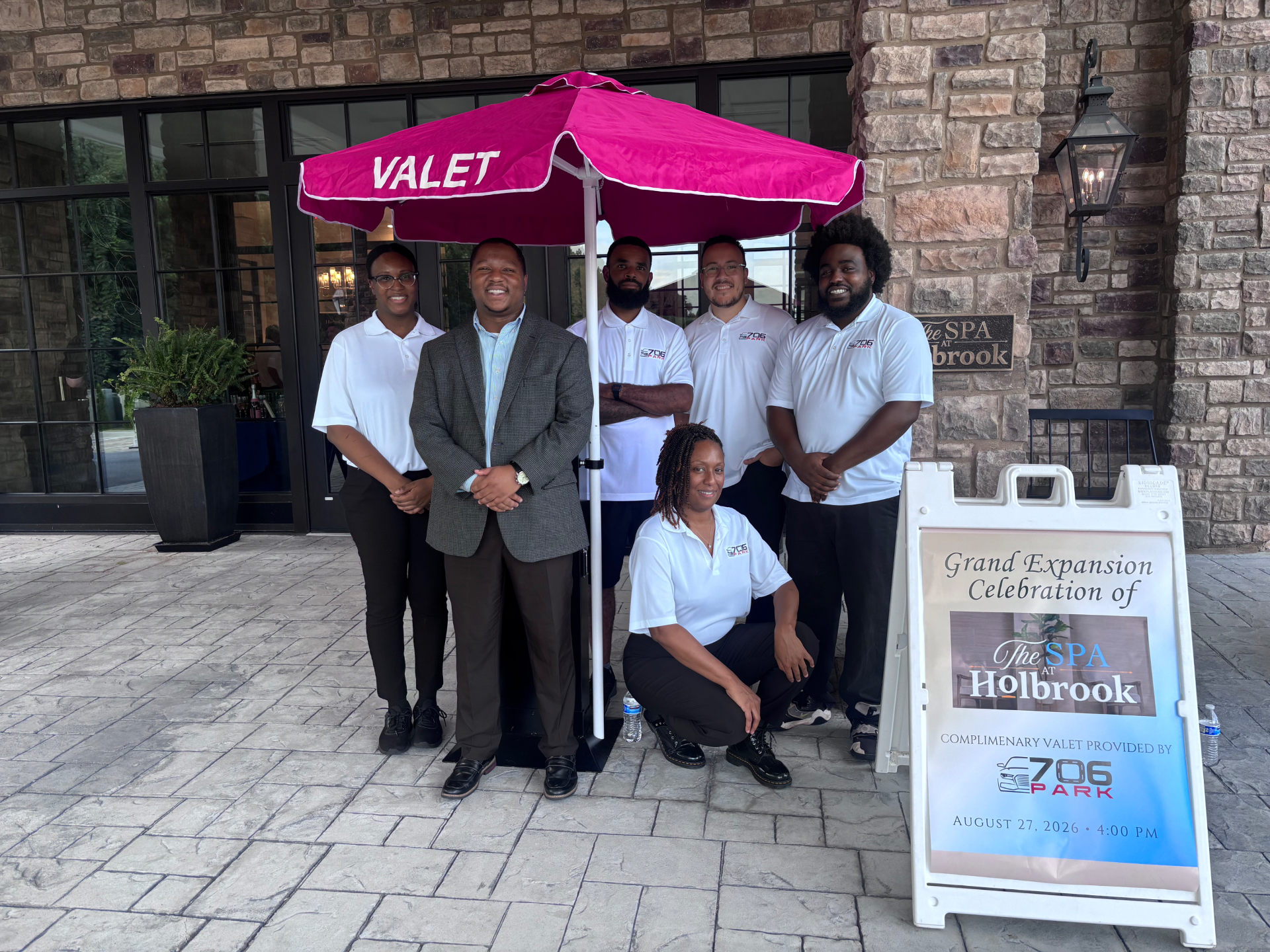 Richard Tolbert with the 706 Parking Management crew under a branded valet umbrella at an Atlanta event
